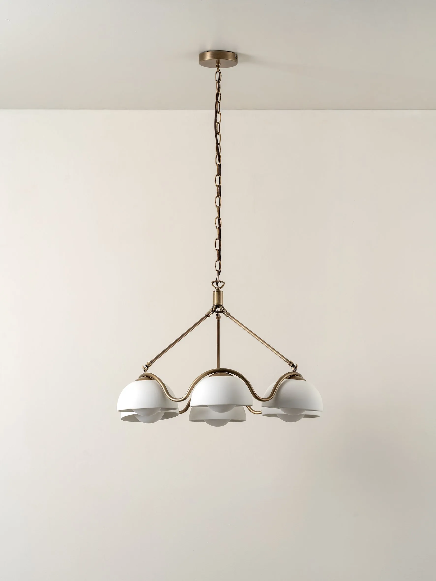 Waverly - 6 light aged brass and white porcelain pendant